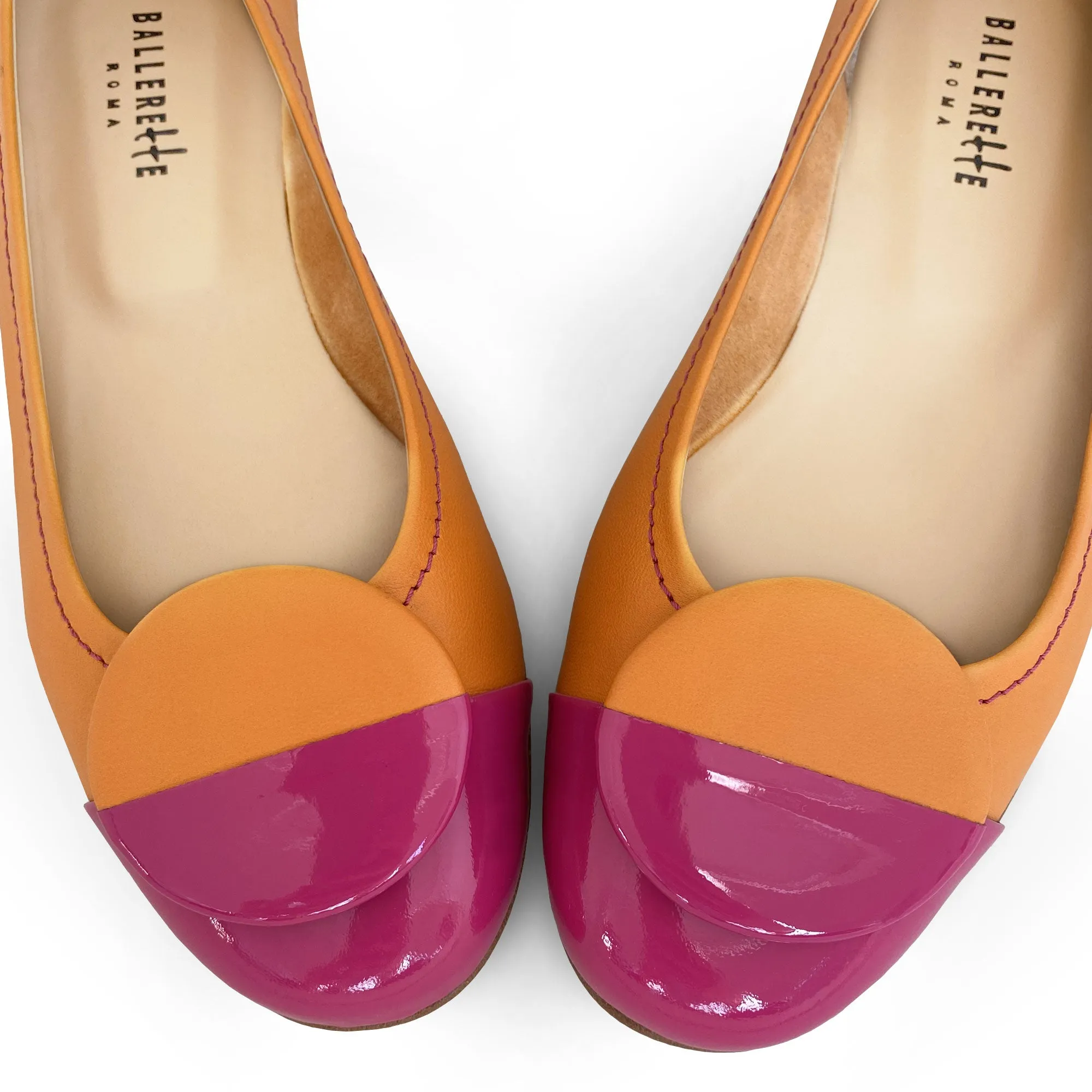 Orange leather ballet flats with fuchsia patent leather toe and stud