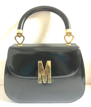 Vintage MOSCHINO black patent enamel Kelly style handbag with M logo and heart motifs. Masterpiece by Redwall. 050323re4